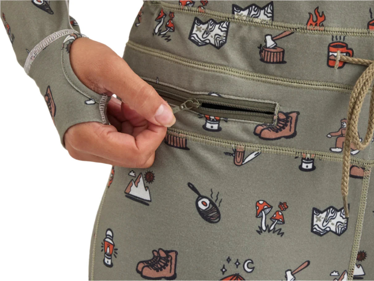 Airblaster Women's Hoodless Ninja Suit 2025 - A sage green onesie with a repeating pattern of brown and white snowboard boots, featuring a zipper on the front.