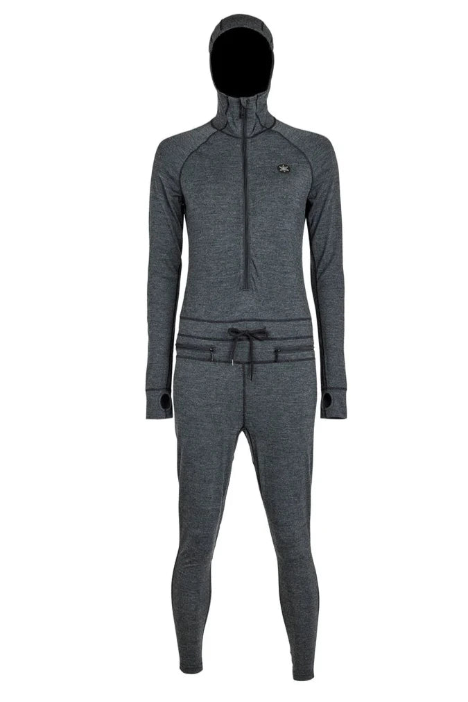 Airblaster Women's Merino Ninja Suit 2025 - A heathered grey women's full-body suit with a hood and thumbholes, featuring a small embroidered logo on the left chest.