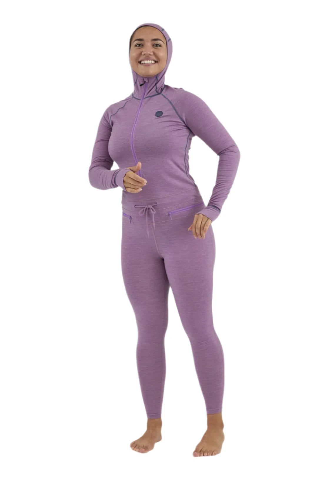 Airblaster Women's Merino Ninja Suit 2025 - A purple merino wool ninja suit with a hood and thumbholes, worn by a model without shoes or socks.