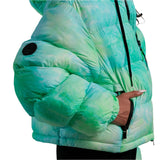 Whitespace Women's Cropped Puffer Jacket 2024 - A cropped puffer jacket with a black zipper and two black circular patches on the left arm.