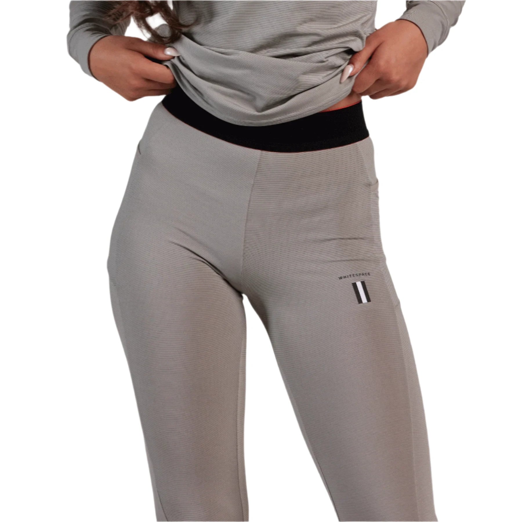 Whitespace Women's Graphene Midweight Base Layer Bottom 2024 - A pair of women's base layer bottoms in a light grey color with thin white stripes.