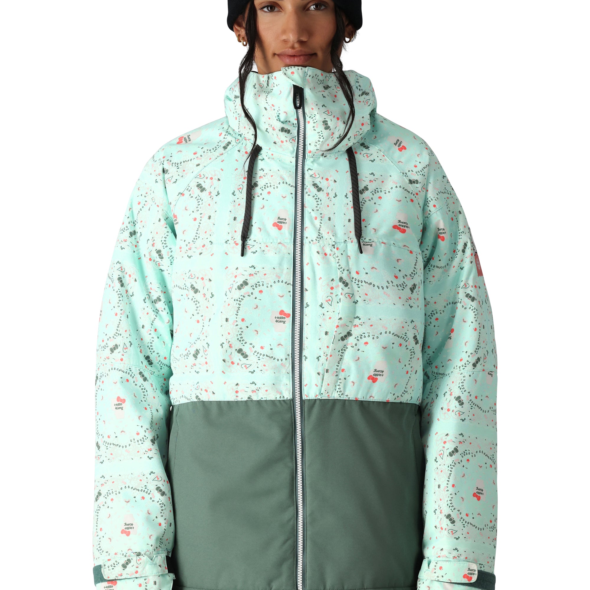The 686 Women's Athena Insulated Jacket 2025 is predominantly light blue with dark green accents and features an insulated hood.
