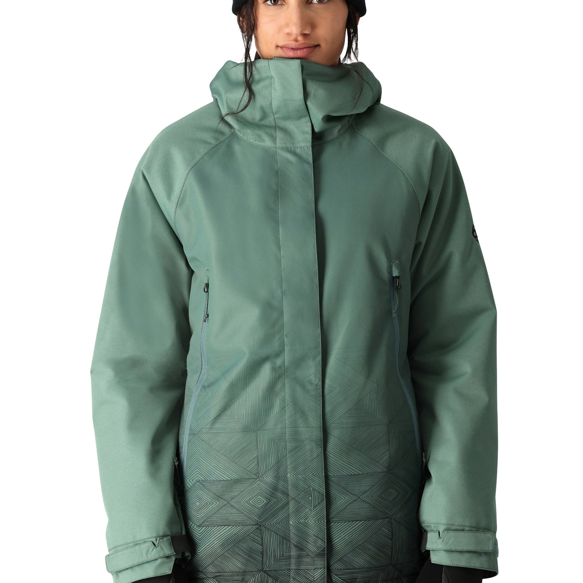 The 686 brand's Fantasia Insulated Jacket 2025 is primarily sage green with a darker sage green pattern on the lower front portion.