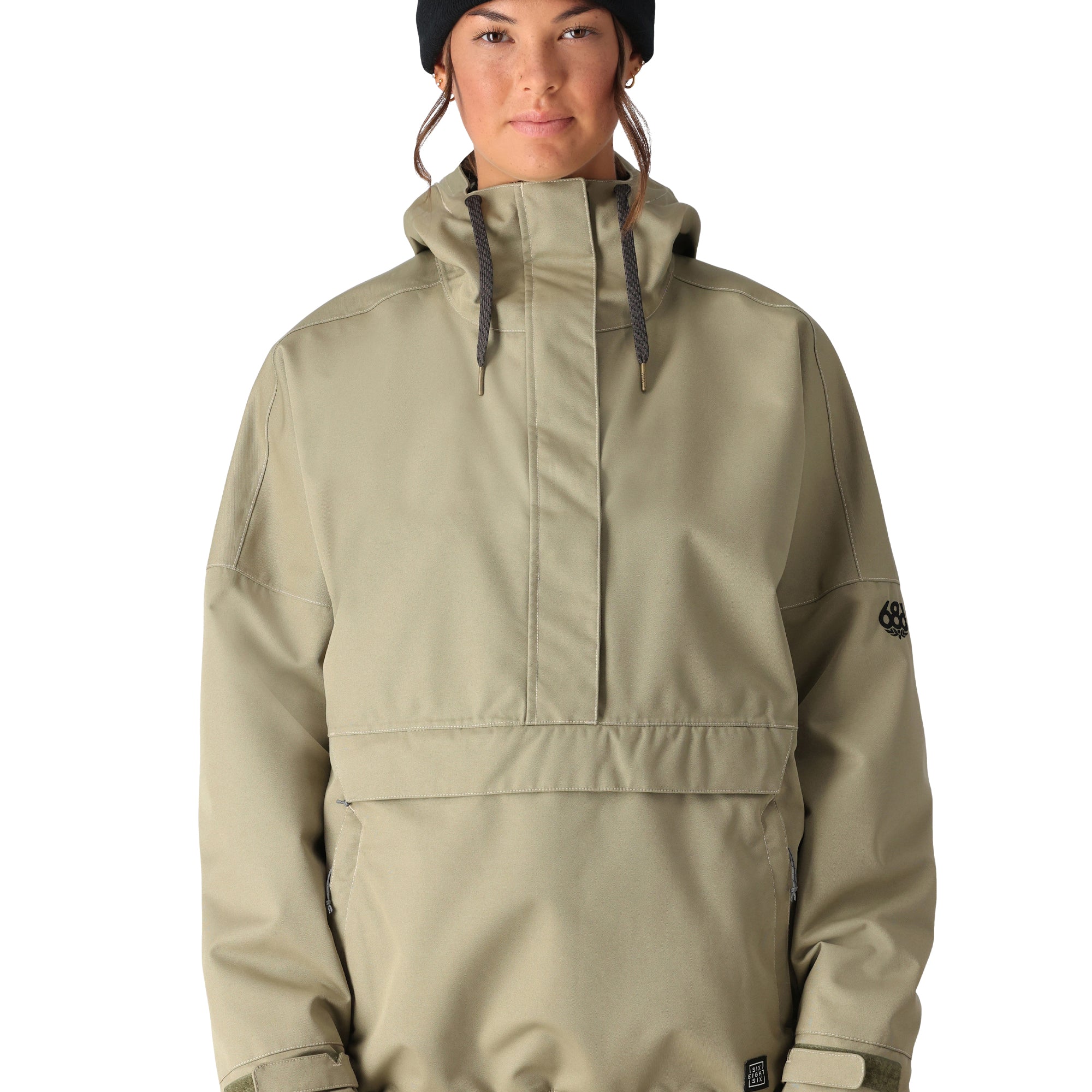 The 686 Women's Outline Shell Anorak 2025 appears in a light olive green color with a high collar and zippered front.