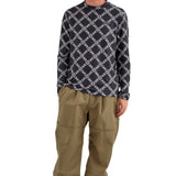 Airblaster Wrench Shell Pant 2025 - A pair of khaki-colored pants with a repeating pattern of white wrenches and bolts.