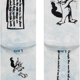 Out of weeks kids c sock 2022 - A pair of white socks with a black cat design on them.