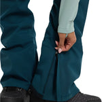 Burton Women's Avalon Stretch 2L Bib Pant 2025 - Dark blue bib pant with a stretchy material and two zippered pockets on the side.