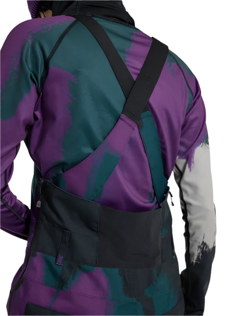 Burton Women's Avalon Stretch 2L Bib Pant 2025 - A pair of purple snow pants with a black bib and adjustable straps.