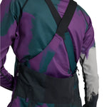 Burton Women's Avalon Stretch 2L Bib Pant 2025 - A pair of purple snow pants with a black bib and adjustable straps.