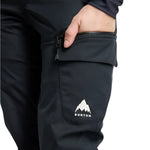 Burton Women's Gloria 2L Stretch Pants 2025 - A pair of black pants with a white logo on the left leg featuring a mountain design and the word "BURTON" in small letters below it.