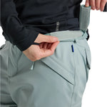 Burton Women's Gloria 2L Stretch Pants 2025 - A pair of light gray snow pants with a subtle pattern and zippered pockets.
