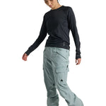 Burton Women's Gloria 2L Stretch Pants 2025 - A pair of light gray snow pants with a black logo on the left thigh and a small zipper pocket on the right hip.