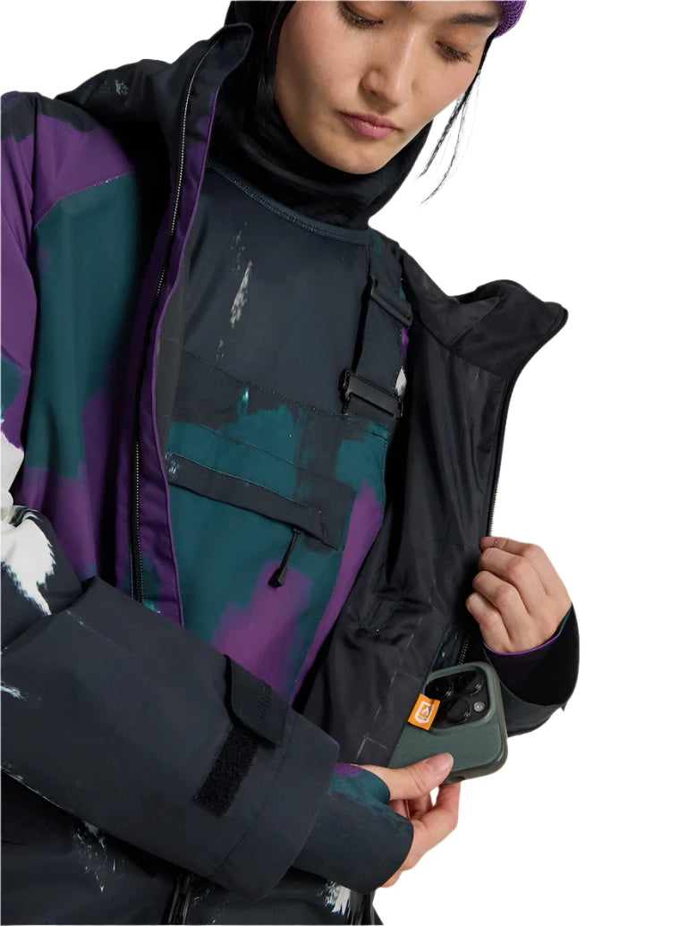 Burton Women's Lalik 2L Jacket - A purple and green camouflage patterned jacket with a black zipper on the chest pocket.