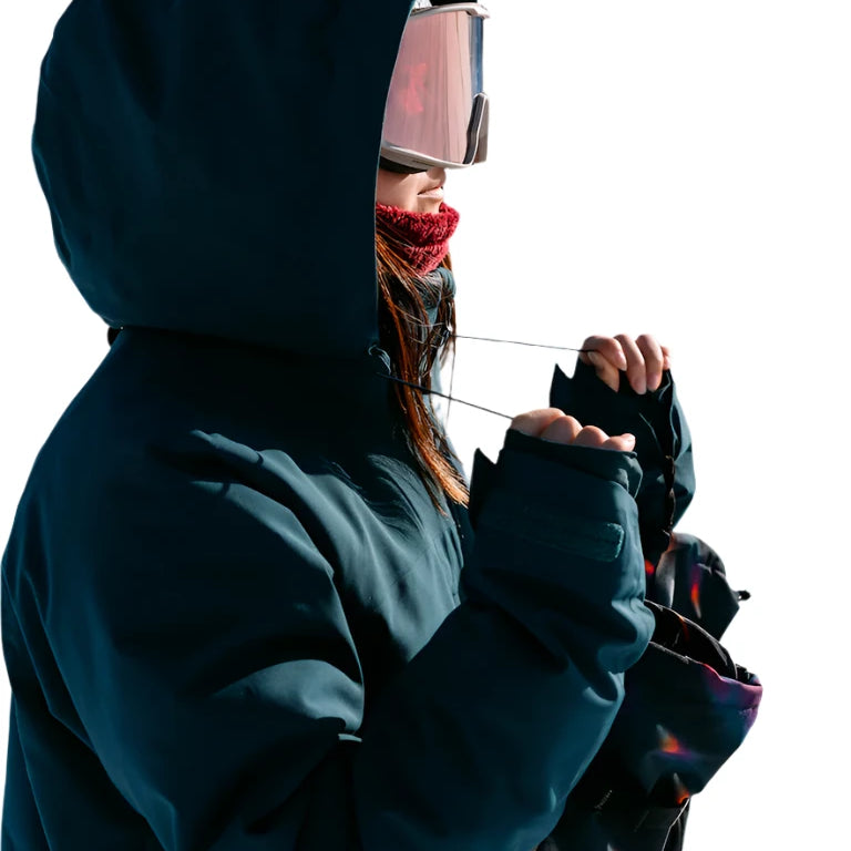 Burton Women's Pillowline GORE-TEX Insulated Jacket 2025 - A dark blue jacket with a hood, featuring a red zipper and a black logo on the left chest.