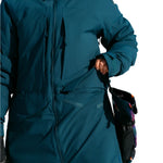 Burton Women's Pillowline GORE-TEX Insulated Jacket 2025 - A dark teal jacket with a hood, featuring a zipper down the front and two zippered pockets on either side.