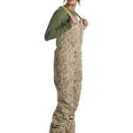 Burton Women's Reserve 2L Stretch Bib Pants 2025 - A pair of khaki-colored snow pants with a subtle floral pattern and adjustable straps.