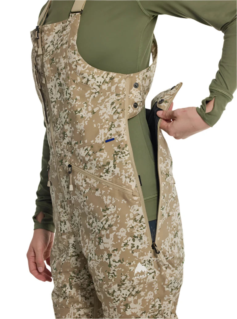 Burton Women's Reserve 2L Stretch Bib Pants 2025 - A pair of khaki-colored snow pants with a subtle floral pattern and adjustable straps at the waist.