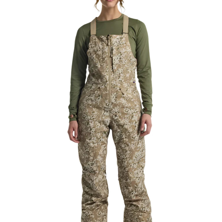 Burton Women's Reserve 2L Stretch Bib Pants 2025 - A pair of khaki-colored snow pants with a subtle floral pattern and adjustable straps.