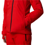 North Face Women's Lenado Insulated Jacket - A woman wearing a red jacket with black zipper and two front pockets, standing against a white background.