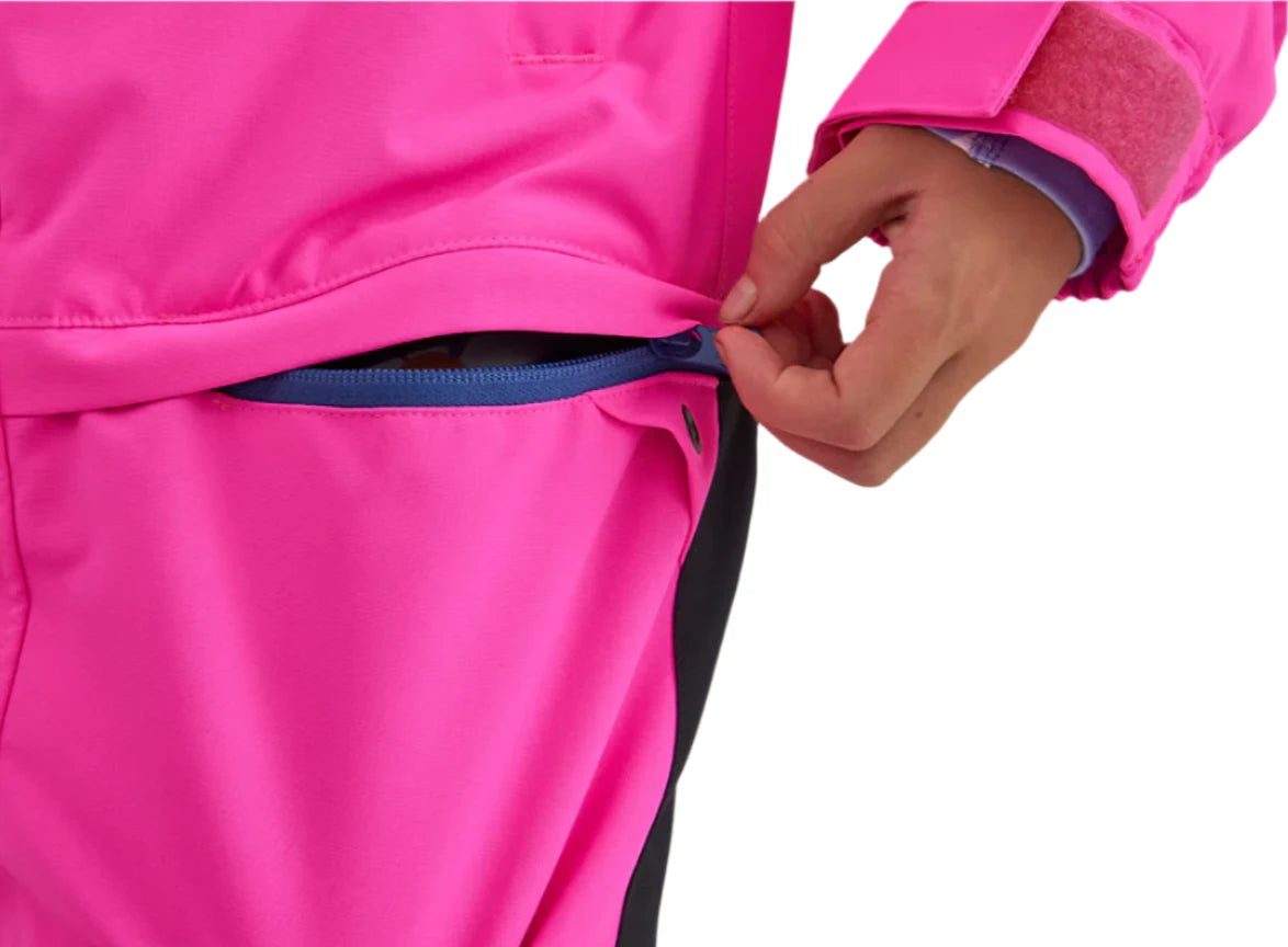Airblaster Junior's Freedom Insulated Suit 2025 - A bright pink snowsuit with a blue zipper and black trim.