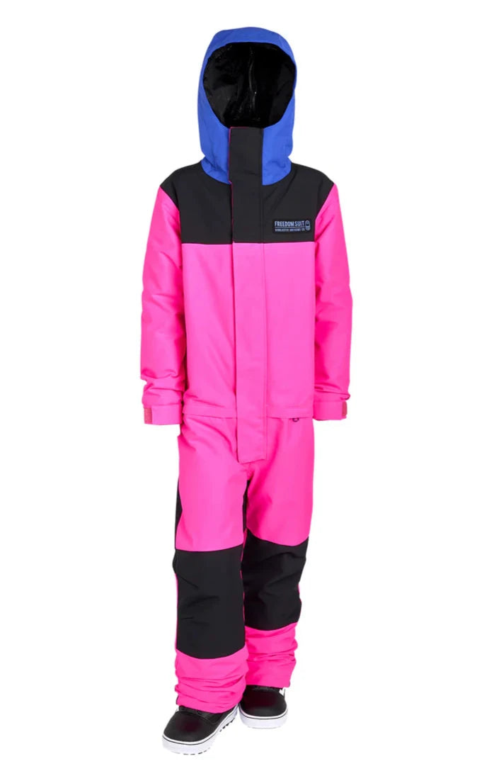 Airblaster Junior's Freedom Insulated Suit 2025 - A bright pink snowsuit with a black chest panel and blue hood, featuring a white logo on the left side of the chest.