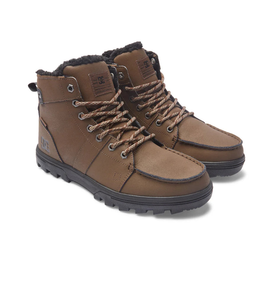 DC Woodland Boots 2024 - A pair of brown leather boots with a rugged sole and laces, set against a white background.