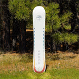 Arbor Women's Mantra Rocker Snowboard 2024 - A white snowboard with a circular logo featuring an image of a tree in the top center, and the word "ARBOR" printed vertically along the bottom edge.