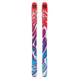 The image shows a pair of Salomon S/Lab QST Blank skis. The skis are predominantly white with a colorful, abstract design on their sides. They have black bindings and are positioned upright against a plain background.