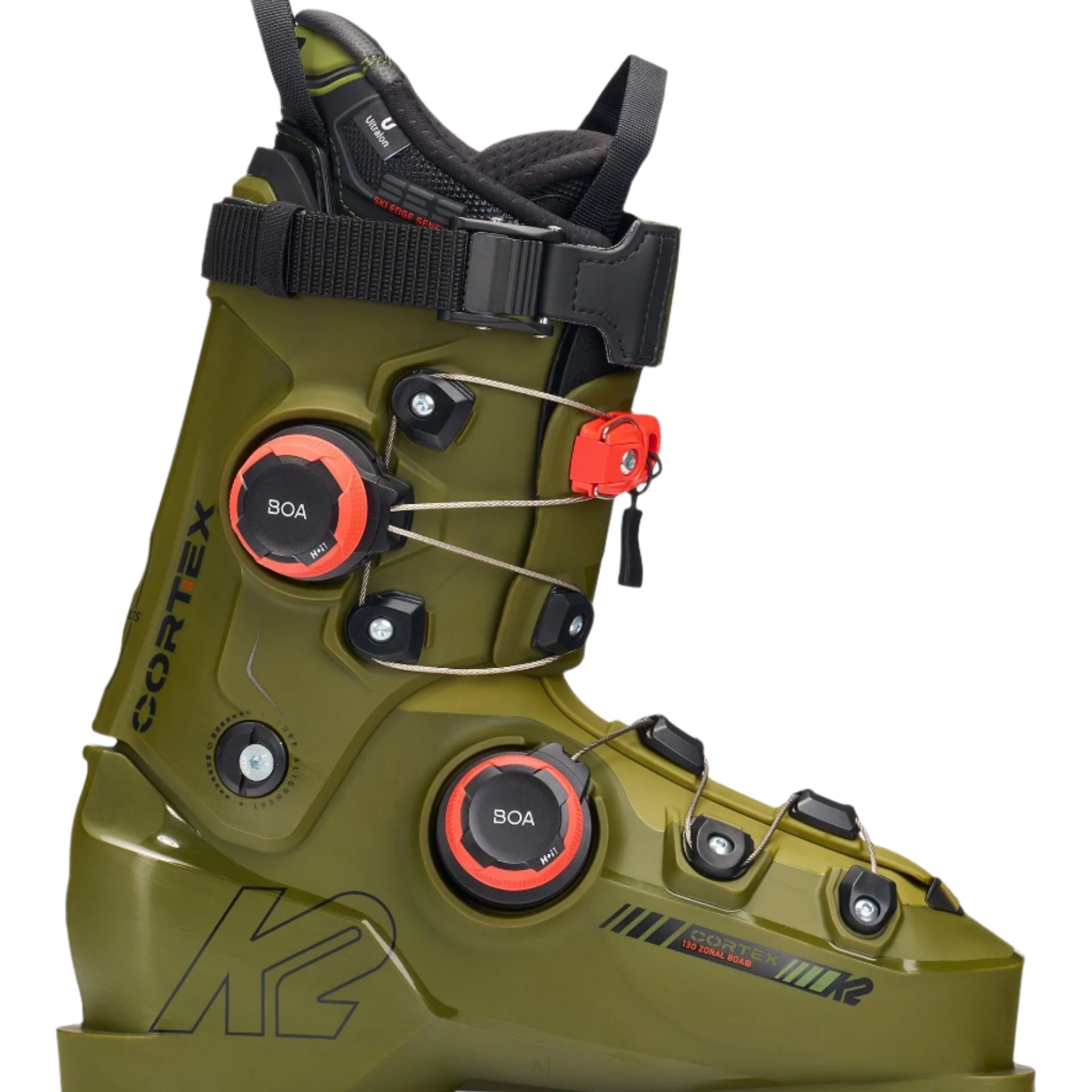 The image shows a pair of K2 Cortex 130 Zonal BOA ski boots for the year 2026. The boots are green and black, with white accents on the straps. They feature a zonal BOA closure system, which allows for adjustable fit and comfort. Additionally, there is a red tag attached to one of the boots, indicating it's new or has been recently purchased.