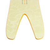 Nitro Cannon Snowboard 2026 - A cream-colored snowboard with a subtle leopard print pattern and orange trim.
