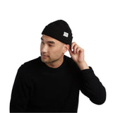 Coal Uniform Low Beanie 2025 - A black beanie with a white rectangular label on the front that reads "COAL" in black letters.