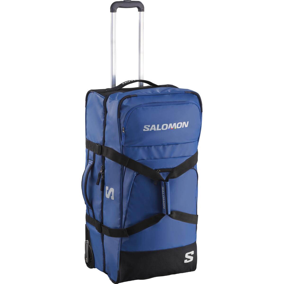 Salomon Race Trip Container 100L Bag 2025 - A large blue duffel bag with black trim and straps, featuring a zippered front pocket and two side pockets.