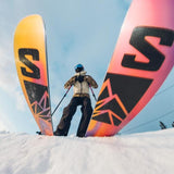 Salomon QST 106 Skis - 2025 model skis with a black and yellow color scheme, featuring a distinctive "S" logo on the top of each ski.