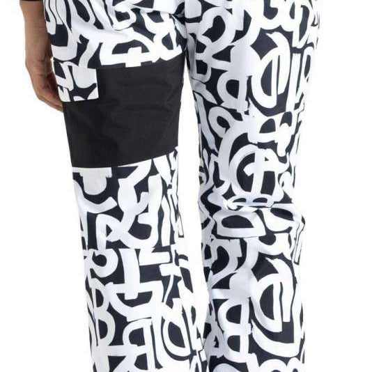 Dare2B Ladies Ice Insulated Pant 2024 - Black insulated ski pants with a white pattern of abstract shapes and lines.