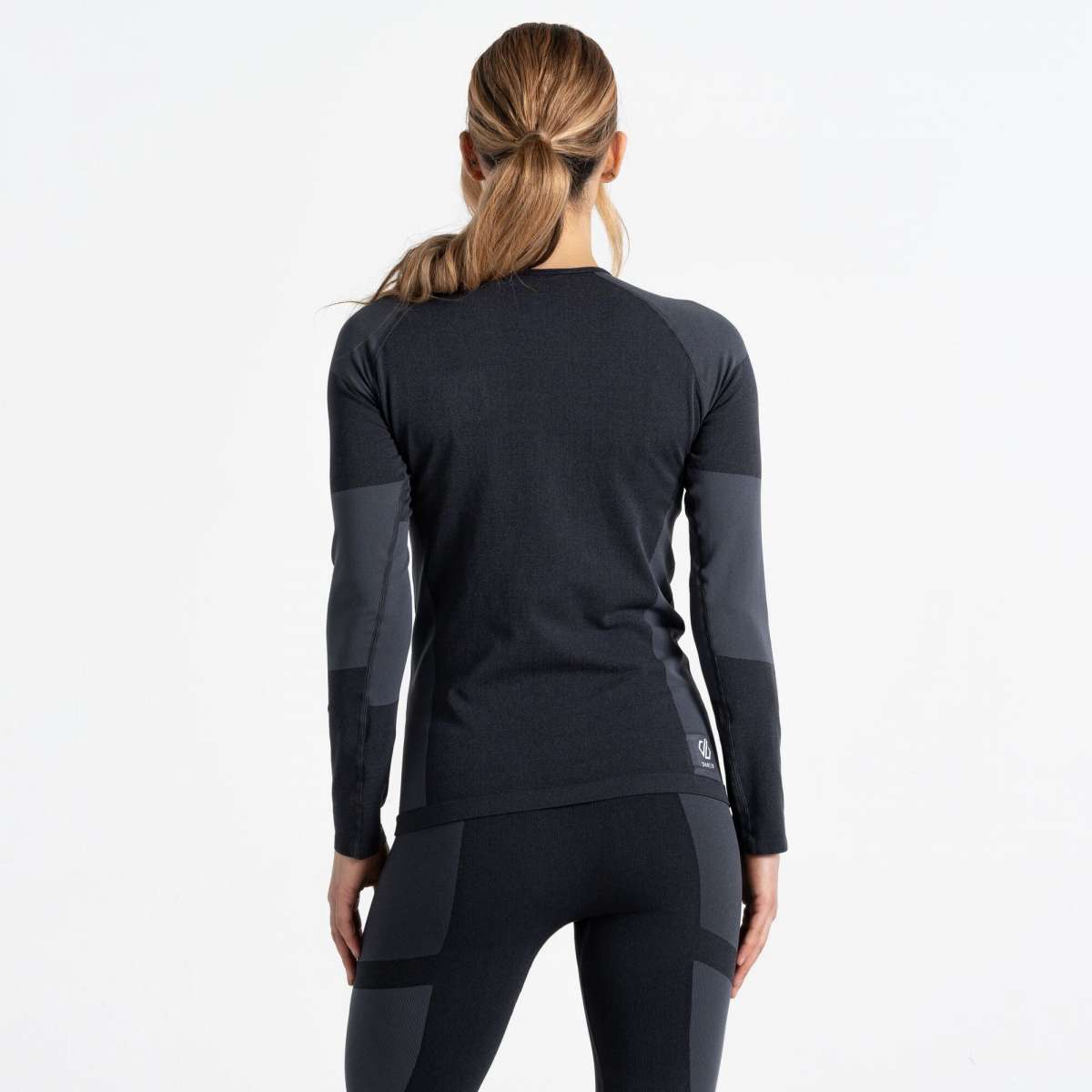Dare2B Ladies In The Zone Long Sleeve Top 2024 - A black long-sleeved top with a crew neck and dark gray panels on the shoulders, chest, and upper arms.