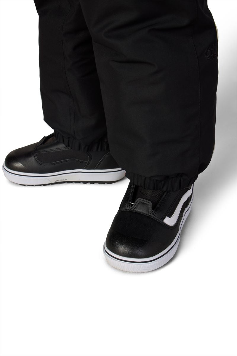 Black boys' shell pants with cuffed ankles and adjustable strap detail