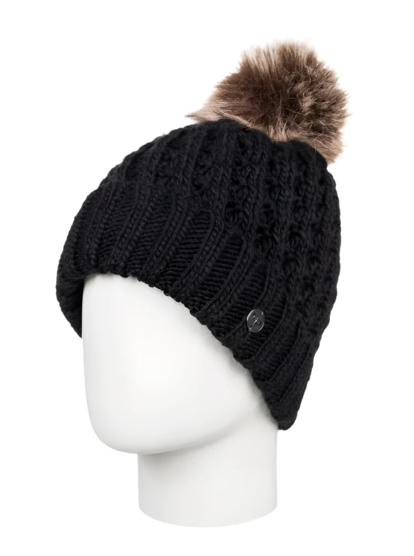 Roxy Junior's Blizzard Beanie 2025 - A black beanie with a brown faux fur pom-pom on top.