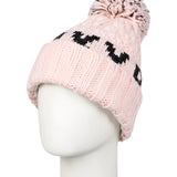 Roxy Junior's Tonic Beanie 2025 - A light pink beanie with a black logo on the front and a matching pom-pom on top.