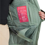 Roxy Women's Illumine Warmlink Jacket 2025 - A sage green jacket with a zippered chest pocket and two zippered pockets on either side.