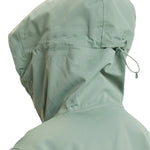 Roxy Women's Illumine Warmlink Jacket 2025 - A sage green jacket with a hood, featuring a drawstring at the waist and two zippered pockets on the front.