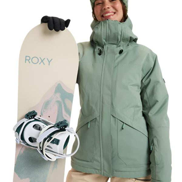 Roxy Women's Illumine Warmlink Jacket 2025 - A sage green jacket with a hood, worn by a model posing in front of a snowy mountain backdrop.