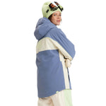 Roxy Women's Ritualized Insulated Jacket 2025 - A blue and white jacket with a hood, worn by a model who is turned sideways to show off the back of the coat.