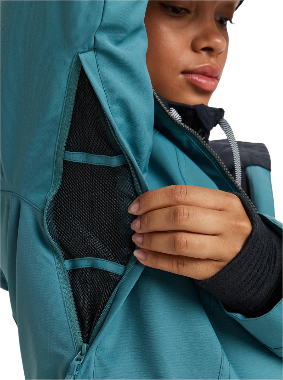 Roxy Women's Meade Insulated Jacket - A woman wearing a black and teal jacket with a hood, zipped up to her neck.