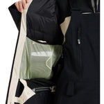 Roxy Women's Wild Twist Jacket 2025 - A black jacket with a white stripe on the sleeve and a zippered pocket on the side.