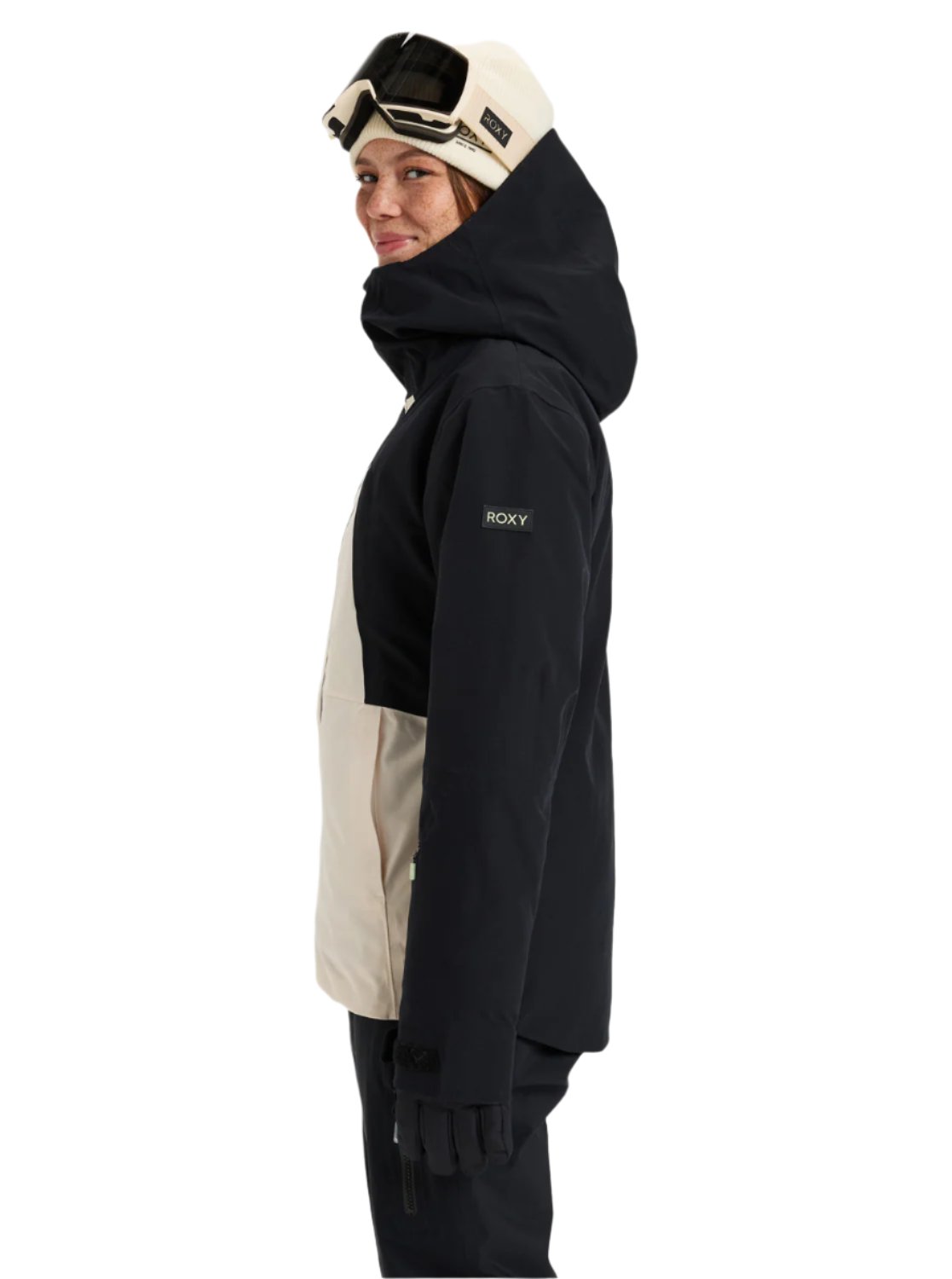 Roxy Women's Wild Twist Jacket 2025 - A black jacket with a tan panel on the side and a hood, featuring a zippered pocket on the left arm.