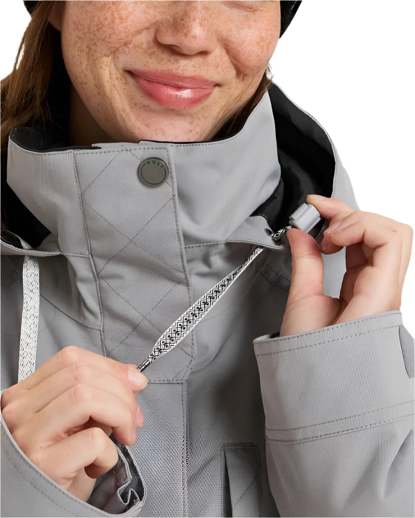 Roxy Women's Billie Insulated Jacket 2025 - A light gray jacket with a black hood and white drawstrings.