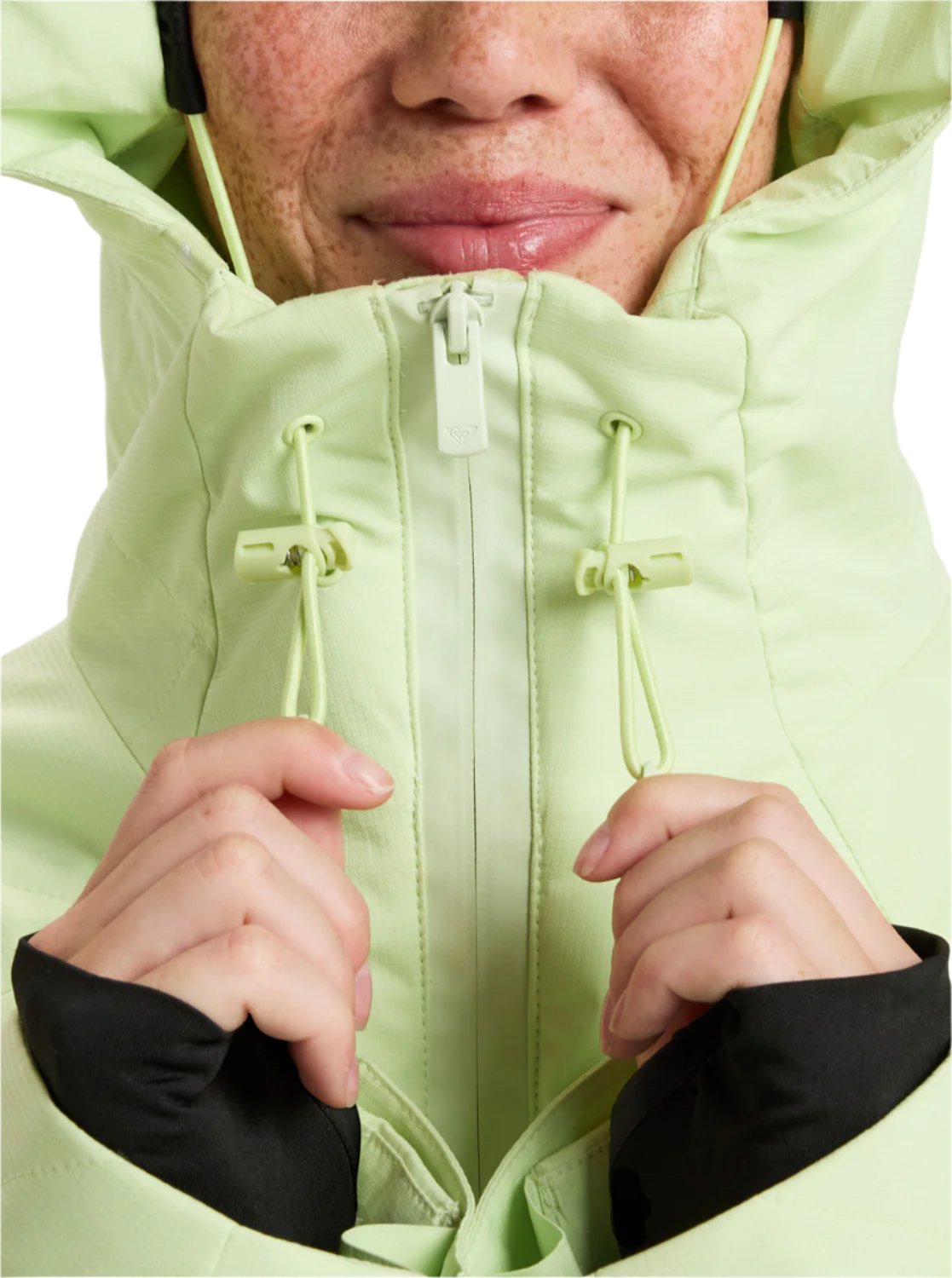 Roxy Radiant Lines Overhead Jacket 2025 - A light green jacket with a hood and drawstrings on the front.