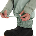 Roxy Women's Chloe Kim Insulated Pant 2025 - Sage green insulated snow pants with white stitching and a zippered pocket on the side of one leg.