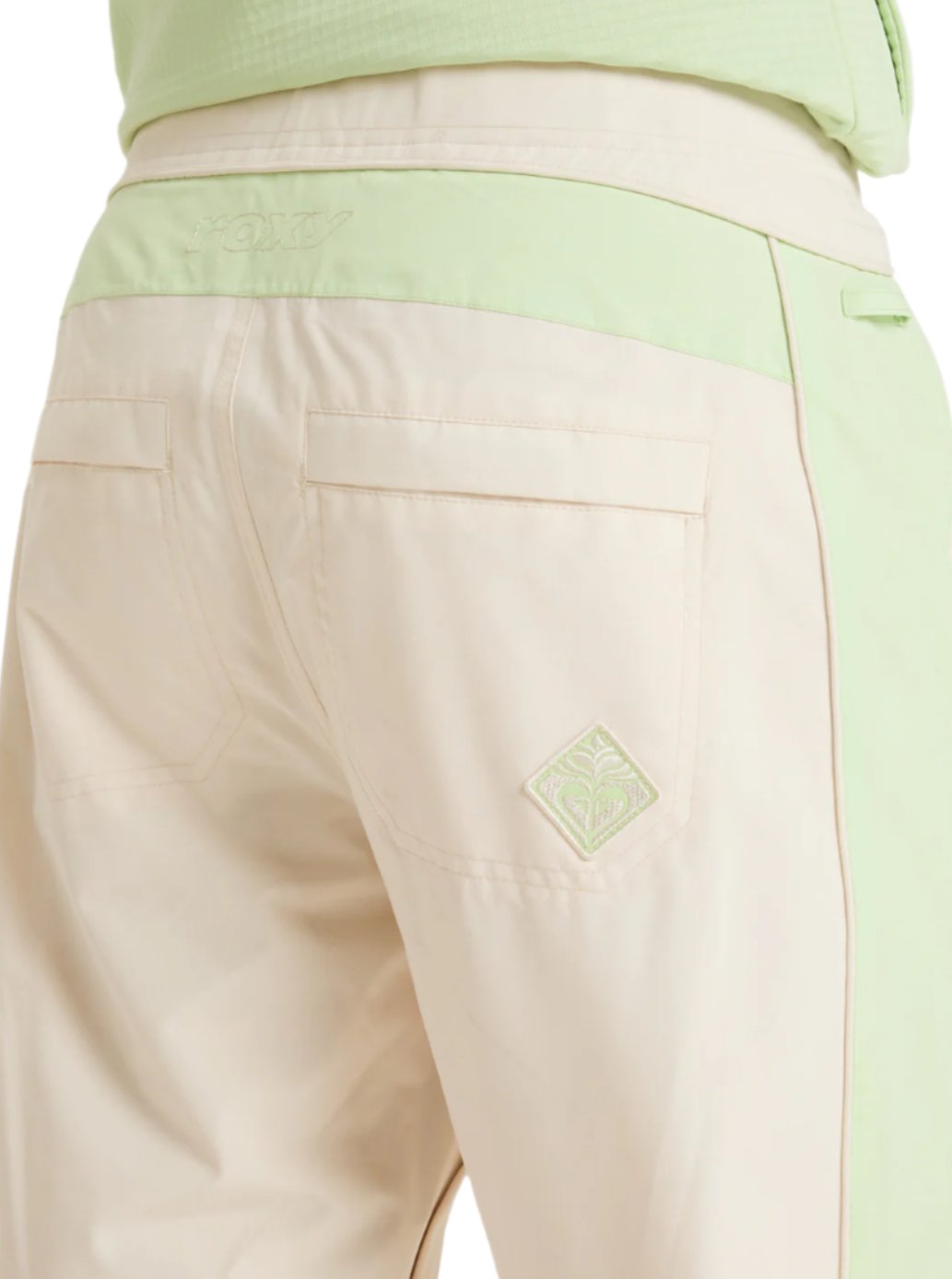 Roxy Women's Steeply Shell Pant 2025 - A pair of light green snow pants with a subtle pattern and zippered pockets.