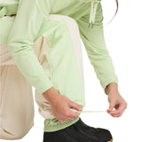 Roxy Women's Steeply Shell Pant 2025 - A pair of light green snow pants with a white stripe down the side and a zippered pocket on the thigh.